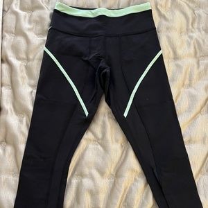 Lululemon cropped leggings with neon yellow detail